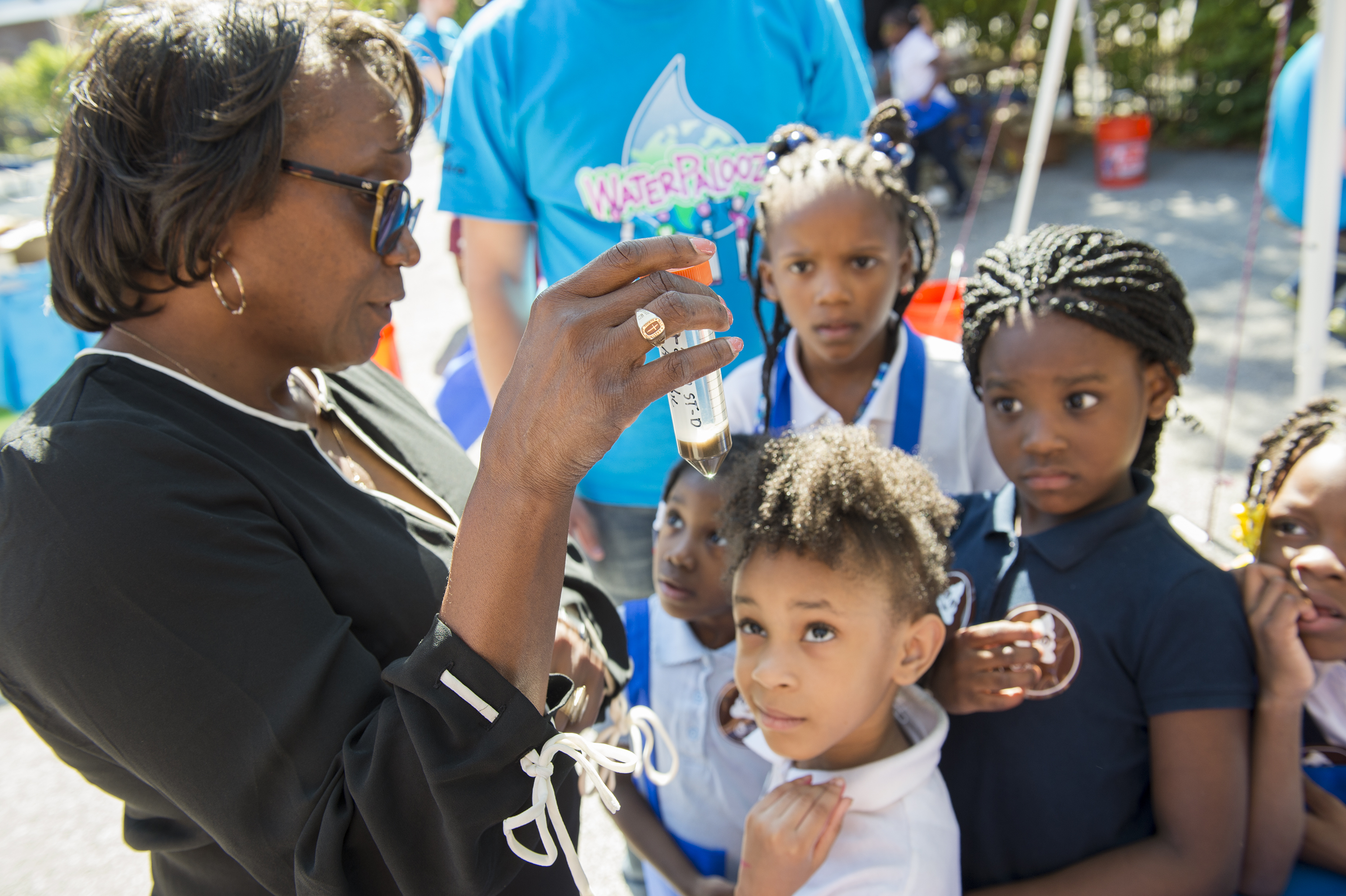 Toni Glymph, Senior Environmental Microbiologist, describes how waste is broken down at water reclamation plants during the WEFTEC 2017 Water Palooza Event at Manierre Elementary School in Chicago.